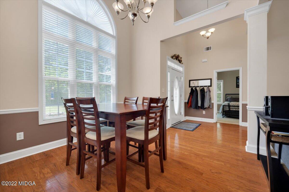 1360 Patterson Road Griffin, GA 30223 - Photo 5 of 24 a view of a dining room with furniture window and wooden floor