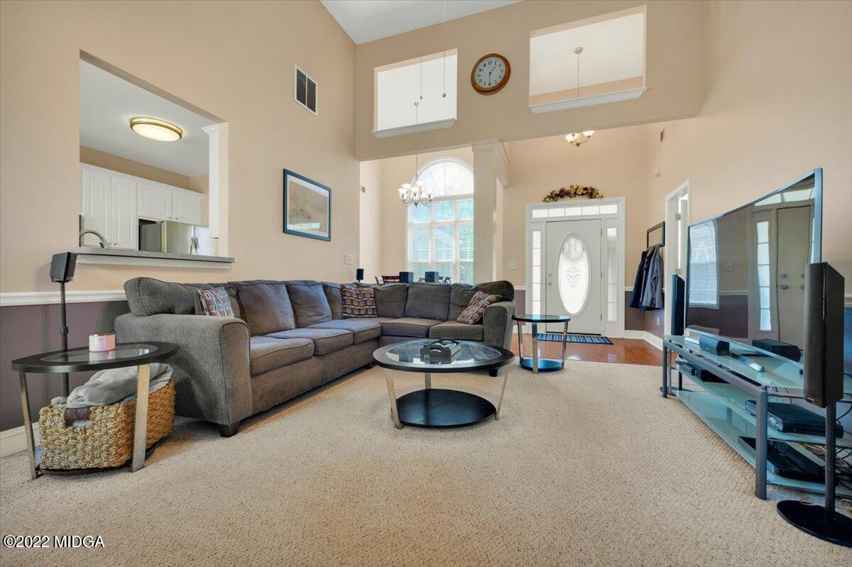 1360 Patterson Road Griffin, GA 30223 - Photo 6 of 24 a living room with furniture and a flat screen tv