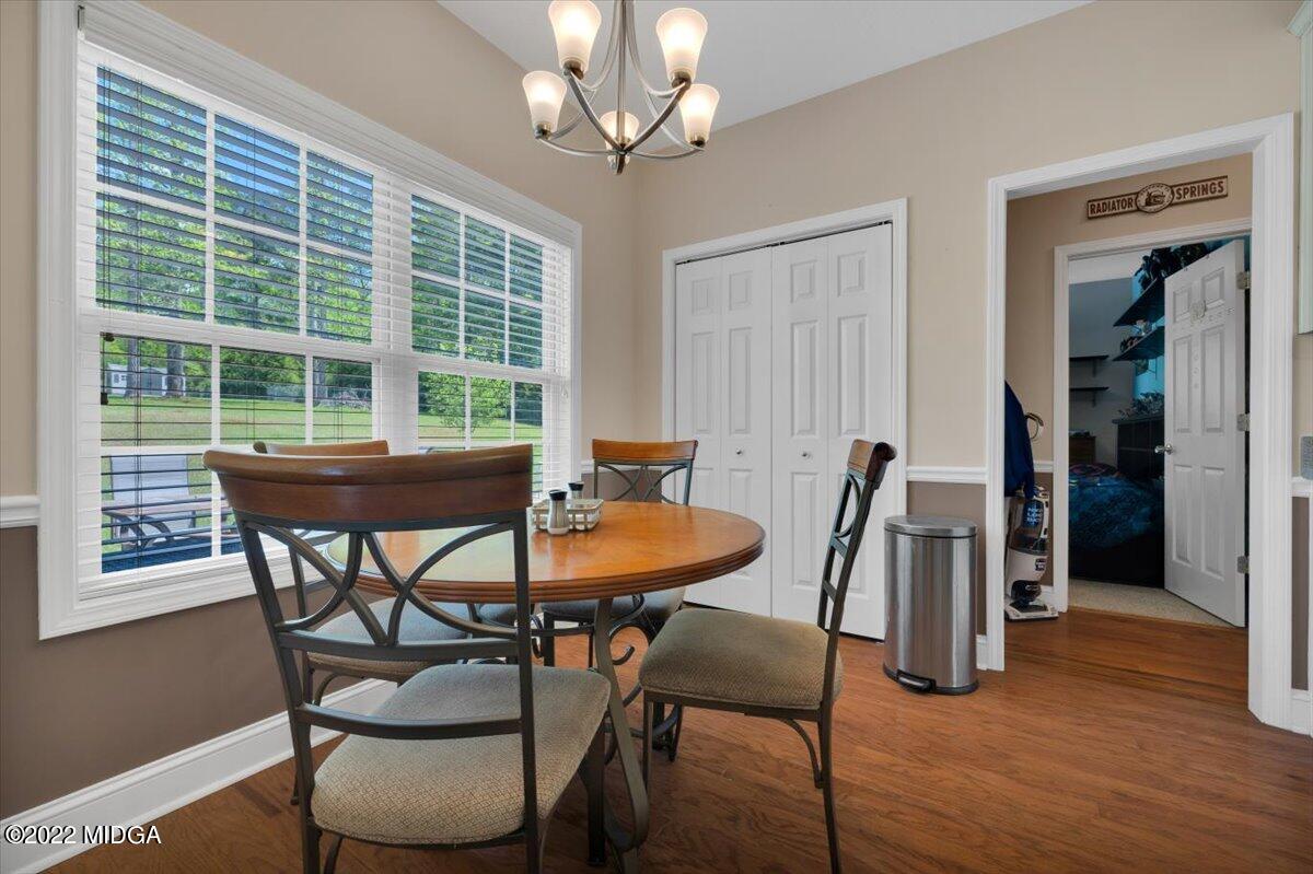 1360 Patterson Road Griffin, GA 30223 - Photo 9 of 24 a view of a dining room with furniture window and wooden floor