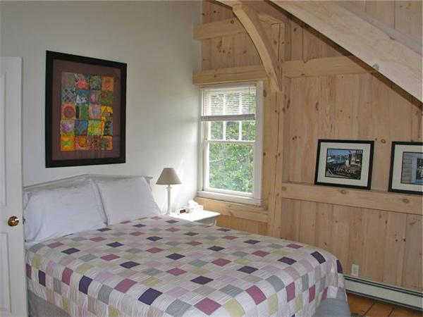 6 Holly Briar Road Aquinnah, MA 02535 - Photo 12 of 15 a bedroom with a bed and a window