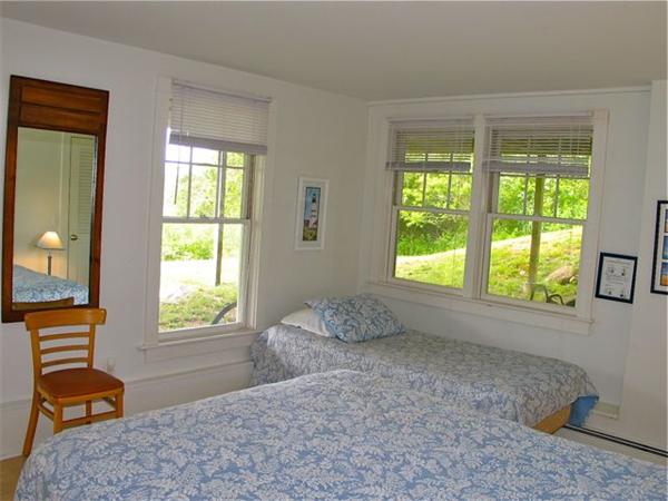 6 Holly Briar Road Aquinnah, MA 02535 - Photo 14 of 15 a bedroom with a bed and a window