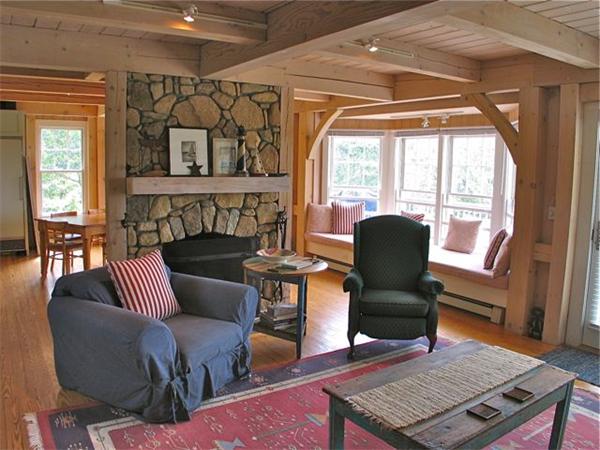 6 Holly Briar Road Aquinnah, MA 02535 - Photo 2 of 15 a living room with furniture and a fireplace