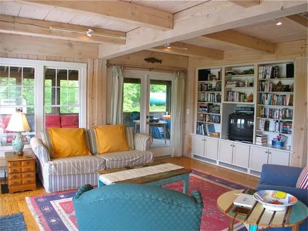 a living room with furniture and a rug