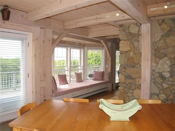 a kitchen with granite countertop a sink appliances cabinets and a counter top space