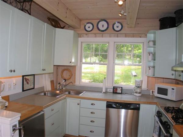6 Holly Briar Road Aquinnah, MA 02535 - Photo 7 of 15 a kitchen with granite countertop a sink appliances cabinets and a counter top space