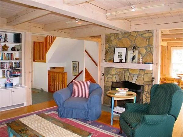 a outdoor living space with furniture and a wooden floor