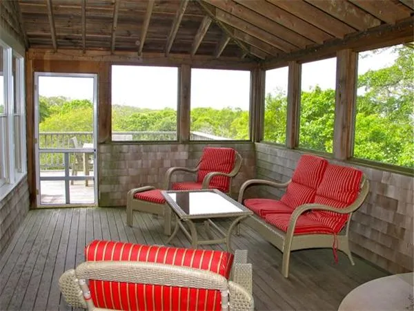a view of chair in wooden deck