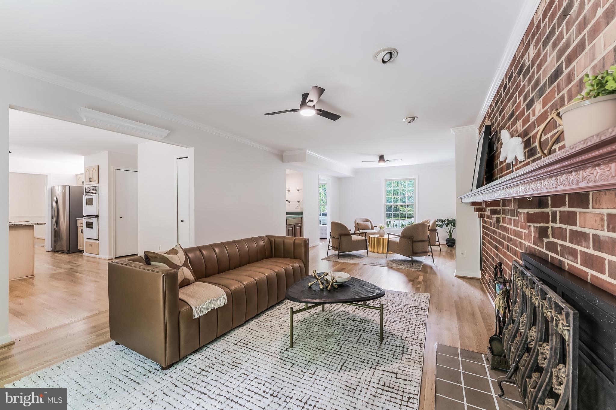 11488 Bingham Terrace Reston, VA 20191 - Photo 23 of 59 Living room with large wood burning fireplace