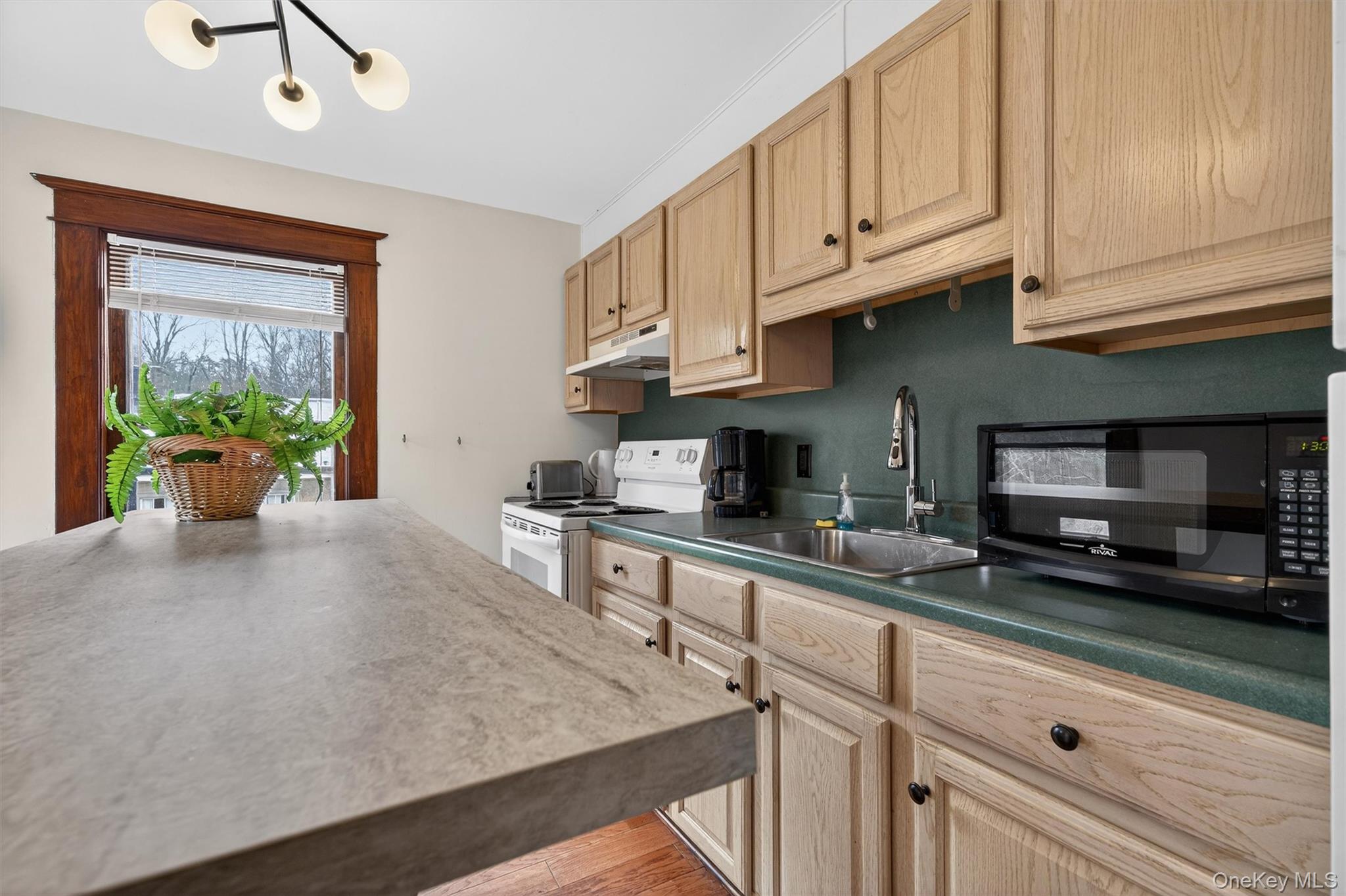 48 Kirks Road Narrowsburg, NY 12764 - Photo 21 of 50 a kitchen with stainless steel appliances granite countertop a sink a stove and cabinets