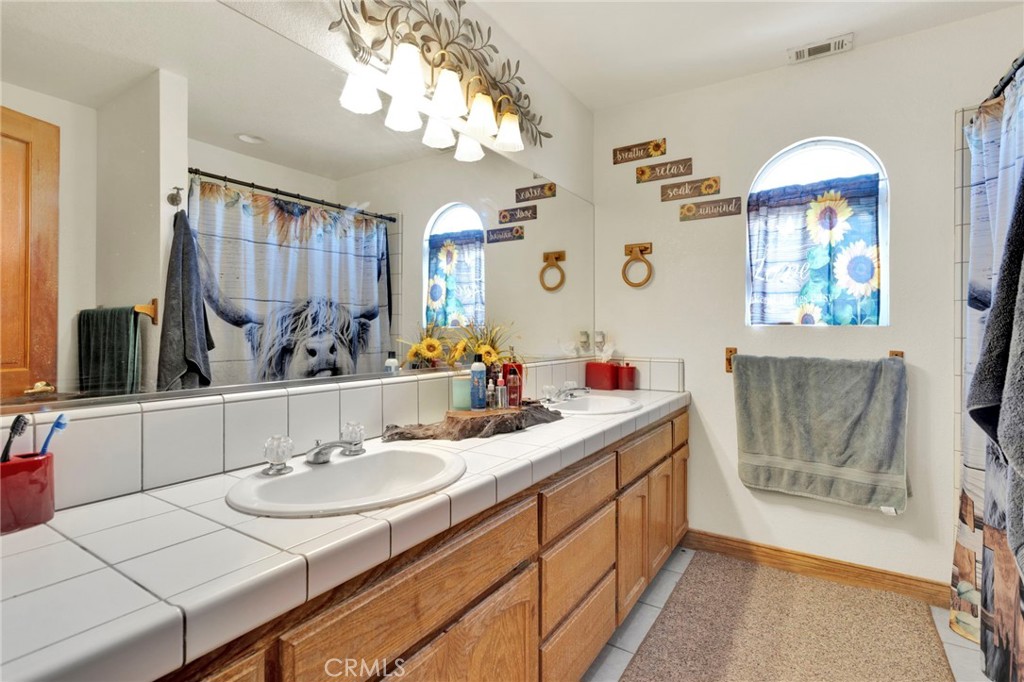10276 Aster Road Oak Hills, CA 92344 - Photo 32 of 67 Hallway Bathroom