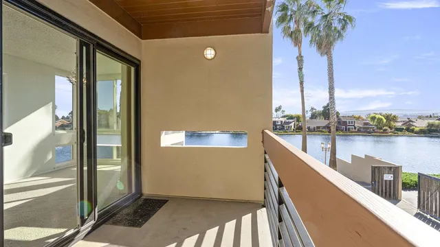 a view of balcony and small swimming pool