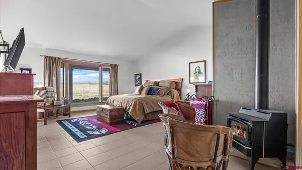 a bed room with a bed and a window