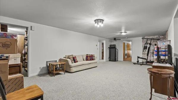 a view of a livingroom with workspace and a couch