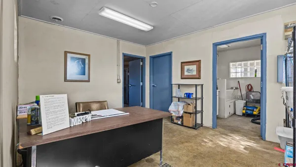 a workspace with furniture and closet