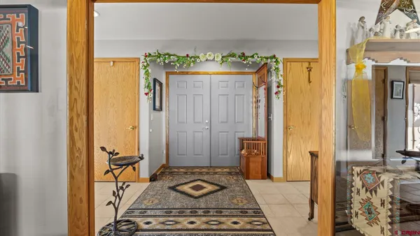 a bathroom with a granite countertop shower and a mirror