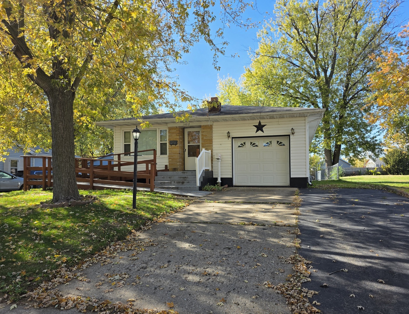 1402 9th Avenue Rock Falls, IL 61071 - Photo 1 of 14 a view of a house with backyard and a tree