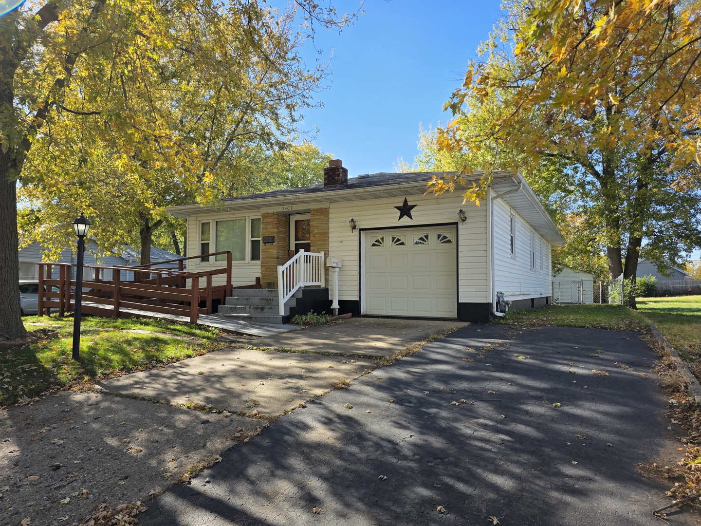 1402 9th Avenue Rock Falls, IL 61071 - Photo 2 of 14 a view of a house with backyard and a tree