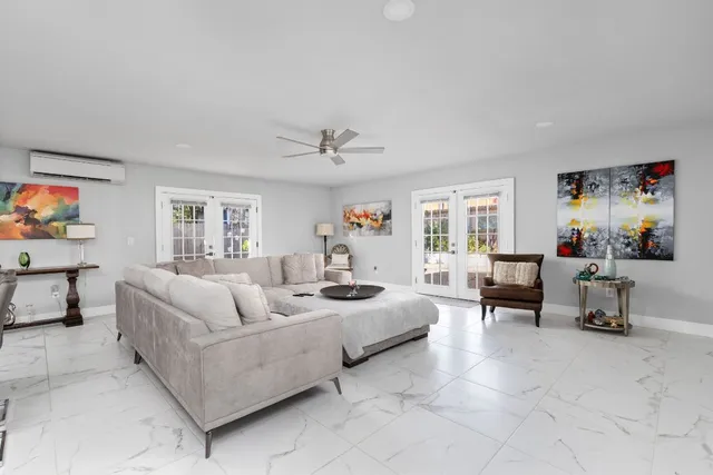a view of a patio with table and chairs and potted plants