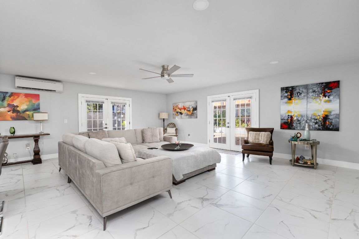 3308 Bengston Street Austin, TX 78702 - Photo 12 of 25 a living room with furniture and a flat screen tv