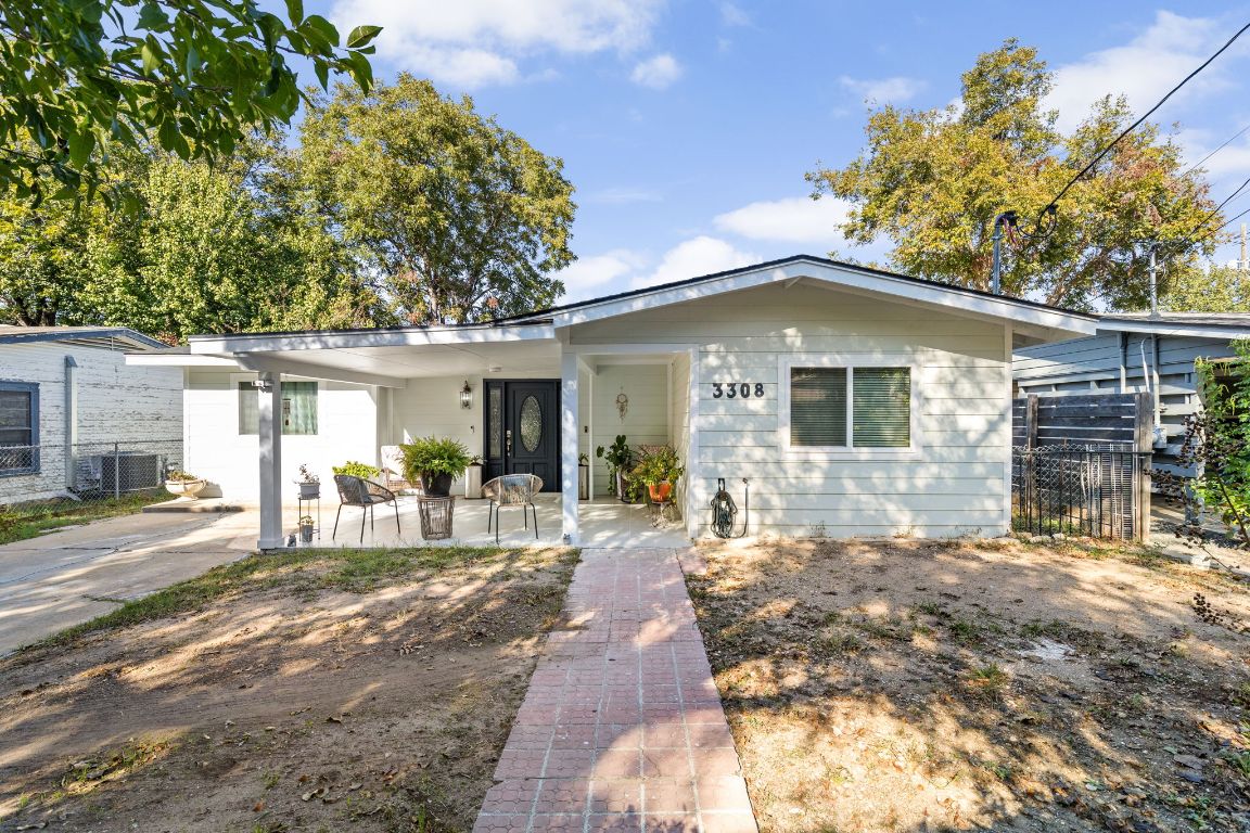 3308 Bengston Street Austin, TX 78702 - Photo 2 of 25 a front view of a house with a patio