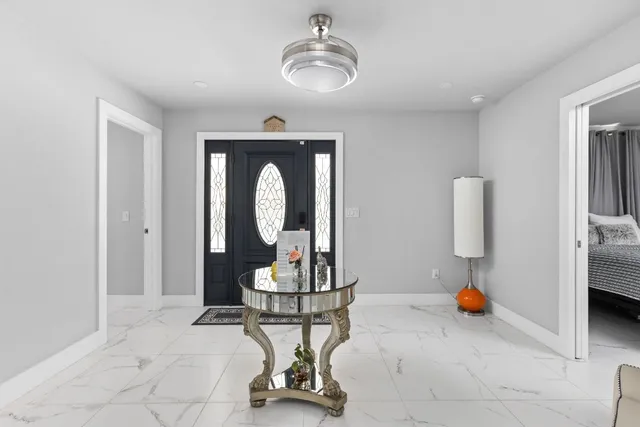 a view of a kitchen with a sink and cabinets