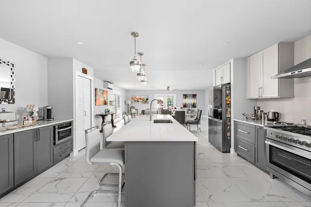 a bedroom with a large bed and a flat screen tv