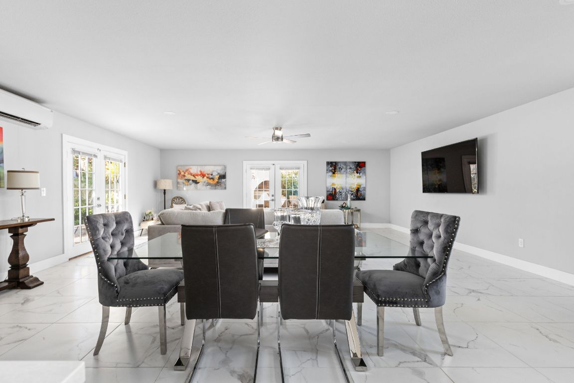 3308 Bengston Street Austin, TX 78702 - Photo 10 of 25 a view of a dining room with furniture and wooden floor