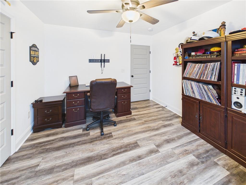 52 Owens Road Fort Mitchell, AL 36856 - Photo 20 of 29 Bright room featuring wood-finish flooring, a ceiling fan with integrated lighting, and white baseboards