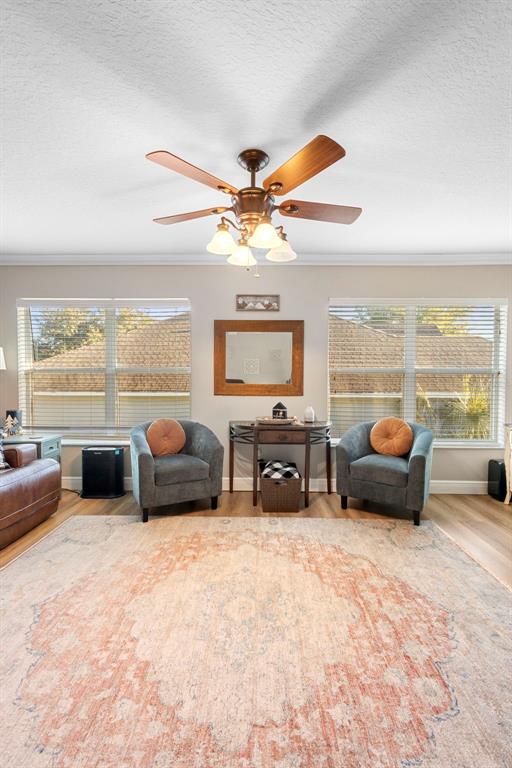 30118 Cheval Street Mount Dora, FL 32757 - Photo 12 of 52 a living room with furniture and a flat screen tv