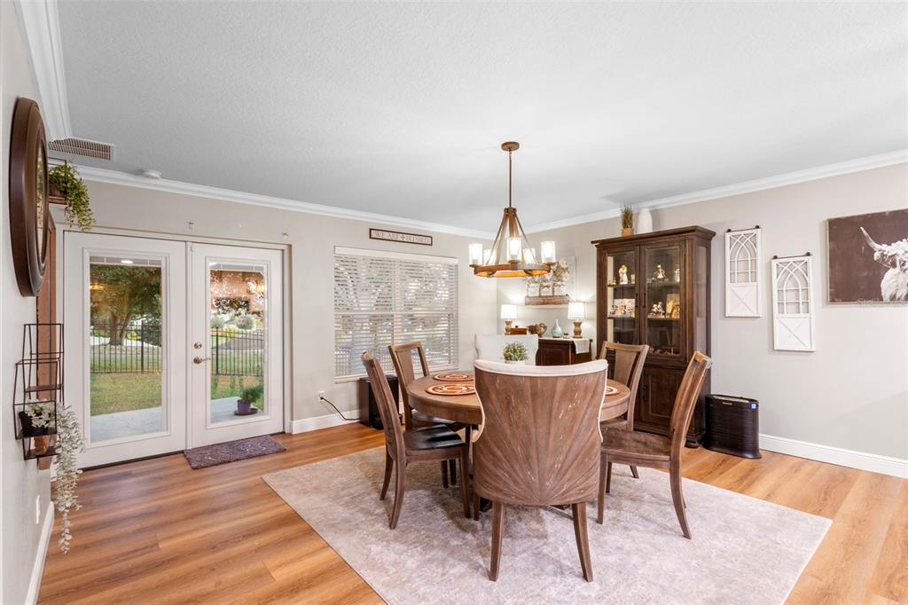30118 Cheval Street Mount Dora, FL 32757 - Photo 18 of 52 a view of a dining room with furniture window and wooden floor