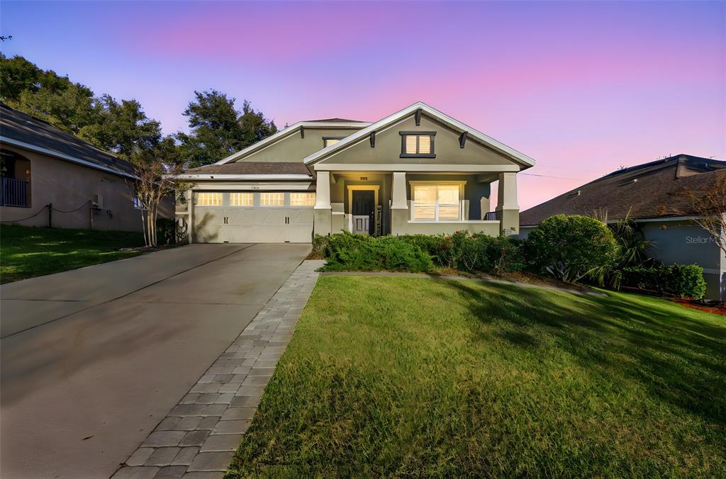 30118 Cheval Street Mount Dora, FL 32757 - Photo 2 of 52 a front view of a house with a yard