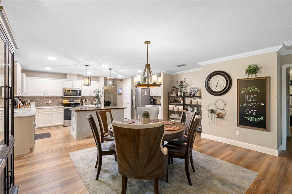30118 Cheval Street Mount Dora, FL 32757 - Photo 21 of 52 a dining room with furniture and window