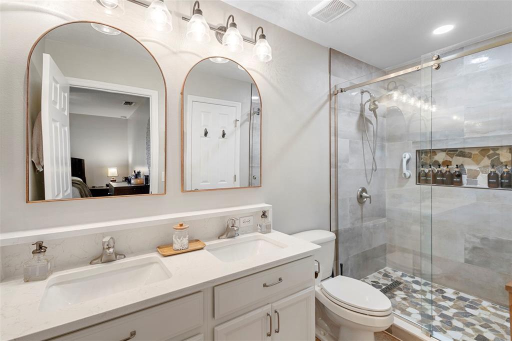 30118 Cheval Street Mount Dora, FL 32757 - Photo 26 of 52 a bathroom with a sink a toilet and shower