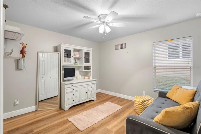 a bedroom with furniture and a chandelier