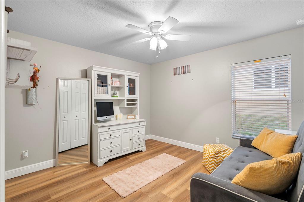 30118 Cheval Street Mount Dora, FL 32757 - Photo 29 of 52 a bedroom with furniture and a chandelier
