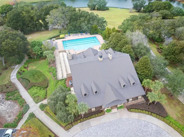 an aerial view of a house with outdoor space and outdoor seating