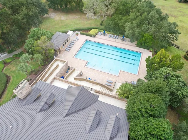 an aerial view of a house with outdoor space