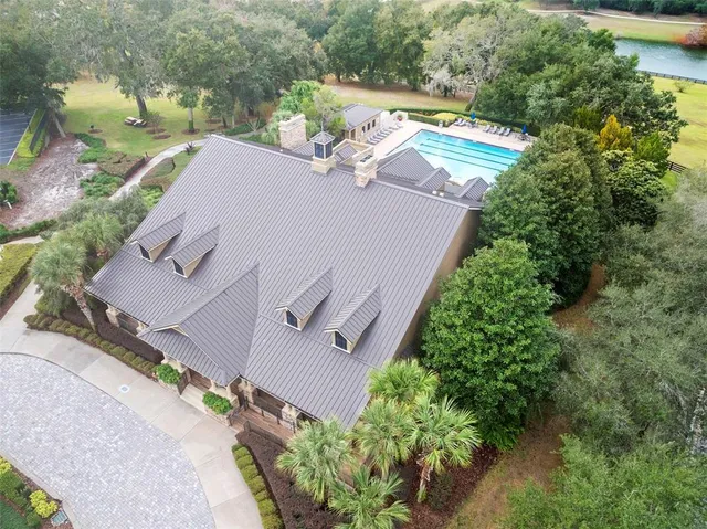 an aerial view of a house with outdoor space
