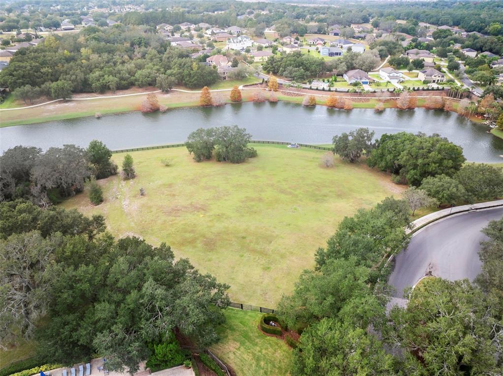30118 Cheval Street Mount Dora, FL 32757 - Photo 40 of 52 an aerial view of residential houses with outdoor space and lake view