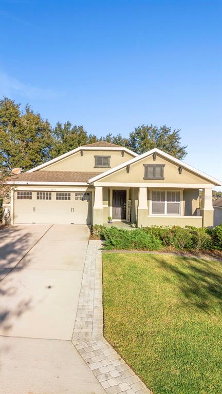30118 Cheval Street Mount Dora, FL 32757 - Photo 49 of 52 a front view of a house with a yard