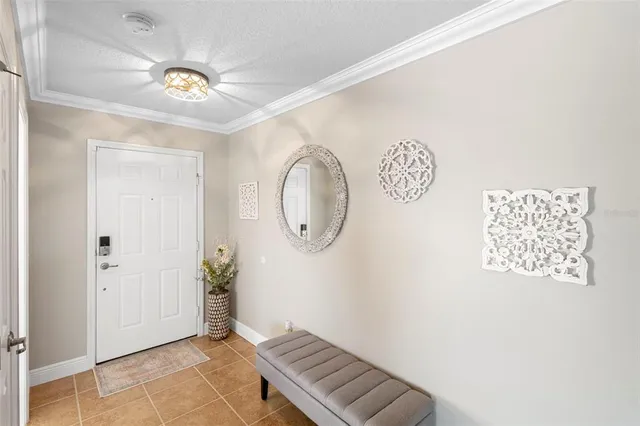 a view of a hallway with entryway wooden floor and front door