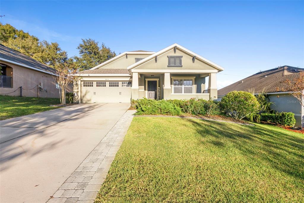 30118 Cheval Street Mount Dora, FL 32757 - Photo 52 of 52 a front view of a house with a garden