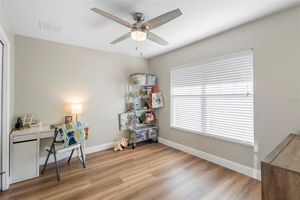 30118 Cheval Street Mount Dora, FL 32757 - Photo 6 of 52 a view of a workspace with furniture and a window