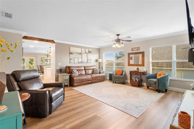 a living room with furniture window and wooden floor
