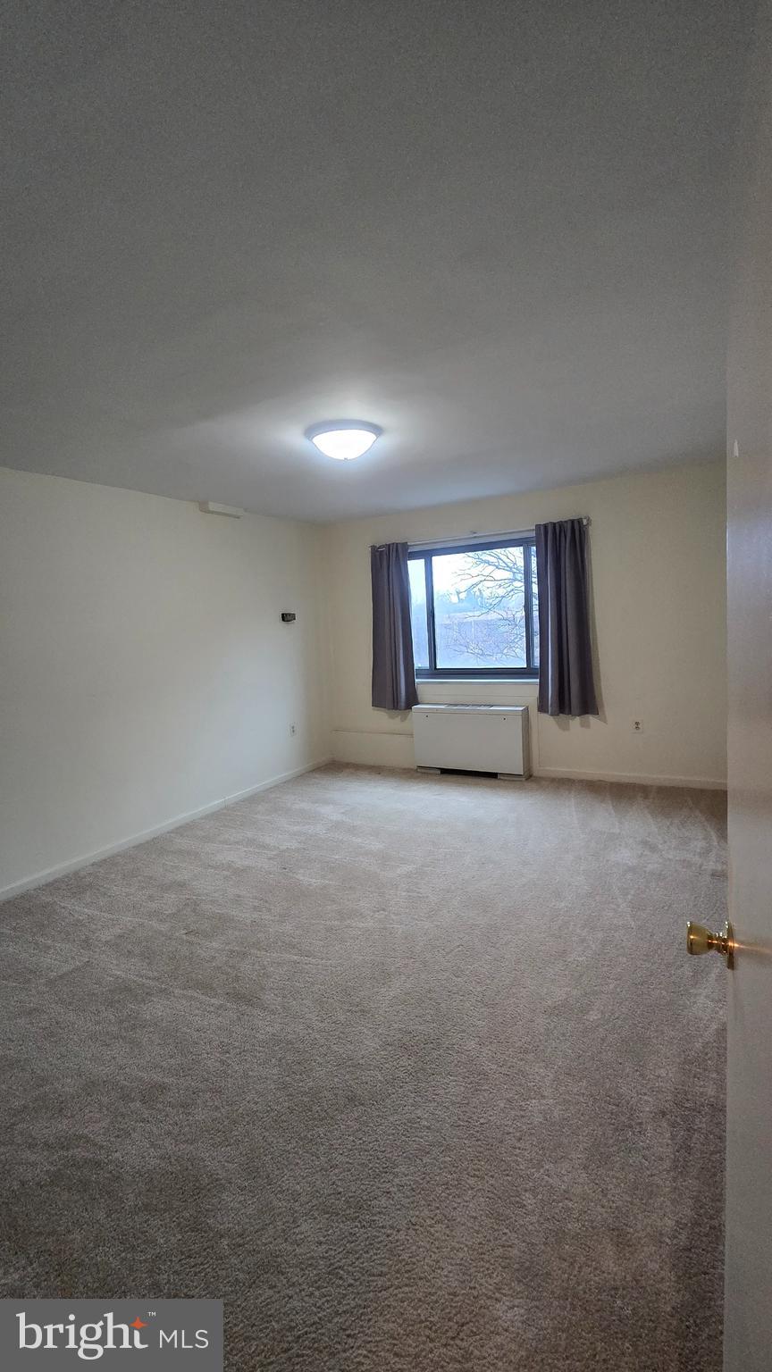 1200 South Arlington Ridge Road, Unit 403 Arlington, VA 22202 - Photo 7 of 23 a view of an empty room with a window
