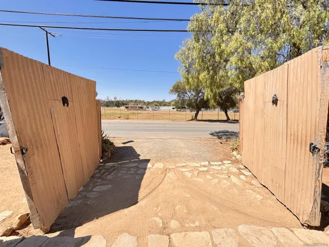 a view of a backyard of the house