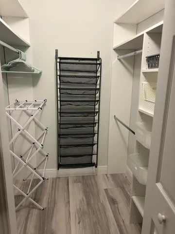 a bathroom with a granite countertop toilet a sink and shower