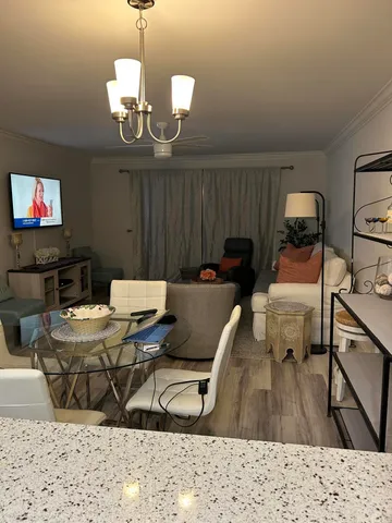 a view of a dining room with furniture