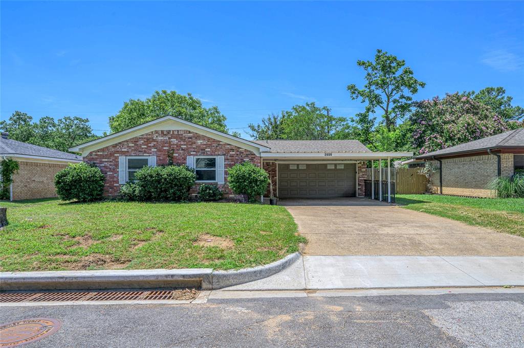 2606 Easy Street Denison, TX 75020 - Photo 1 of 1 front view of a house with a yard