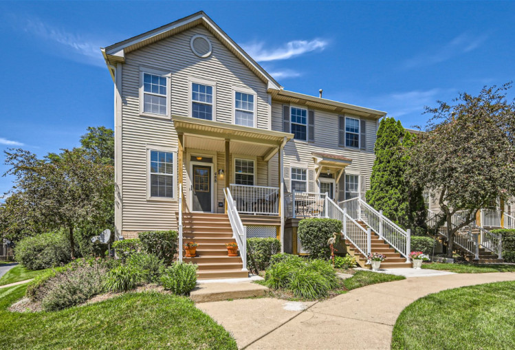 a front view of a house with a yard